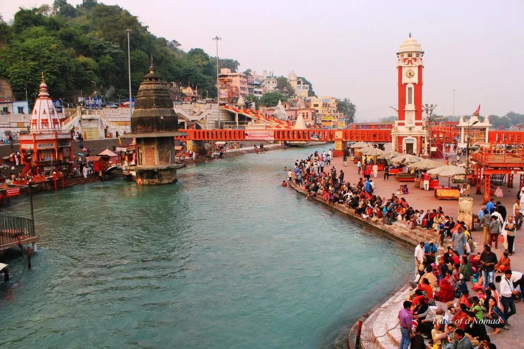 Crowds on the ghats around Brahma Kund and the clock tower in Haridwar