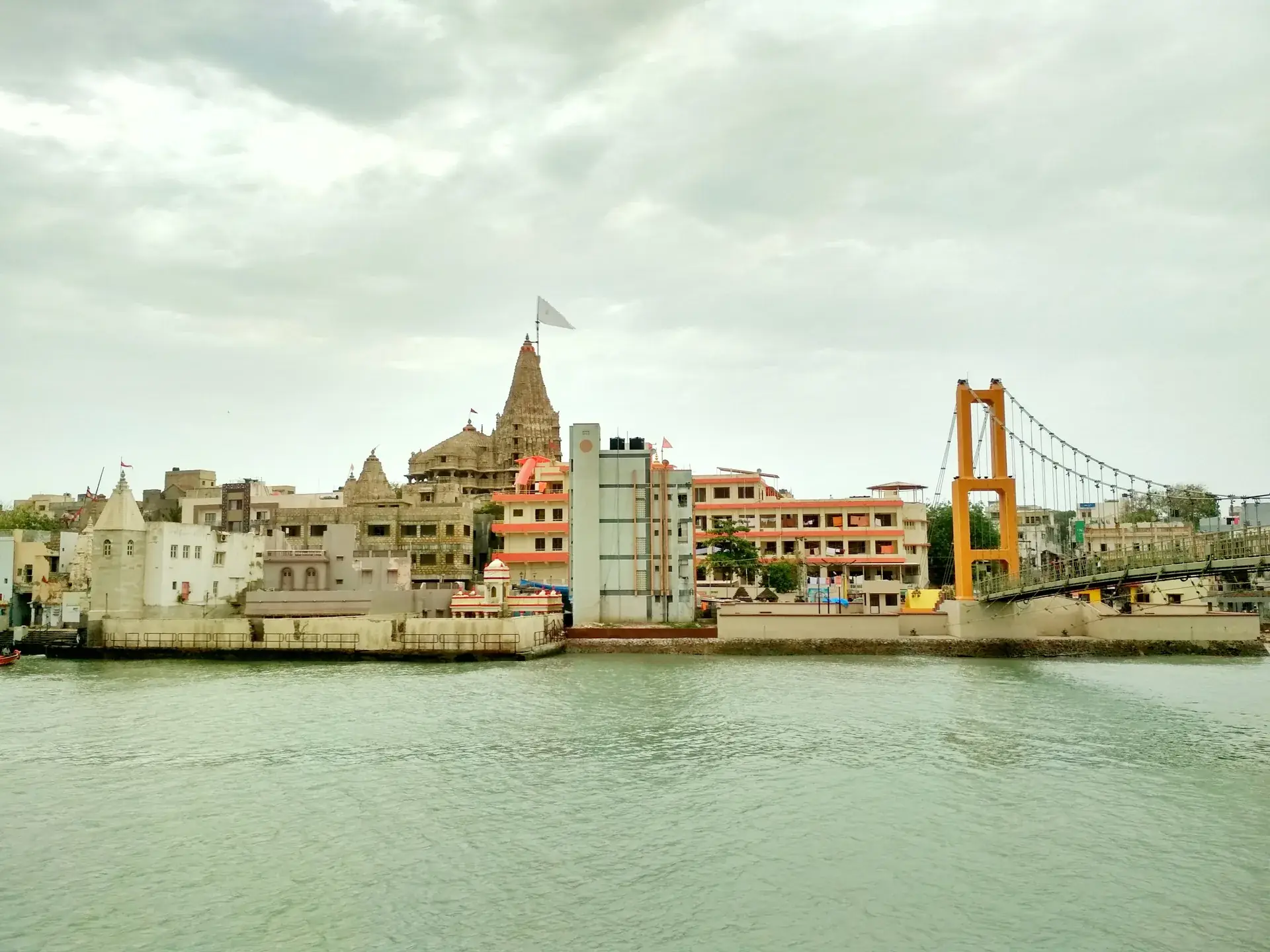 Dwarkadhish Temple above Gomti Ghat in Dwarka, a key stop on the Somnath and Dwarka yatra route